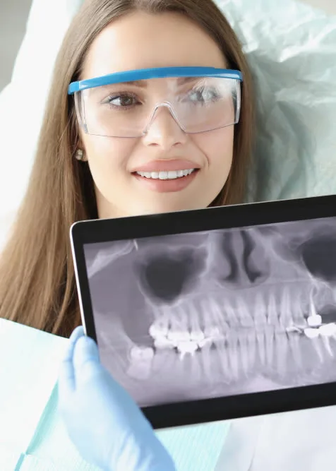 Patient reviewing 3D implant plan at Roam Dental