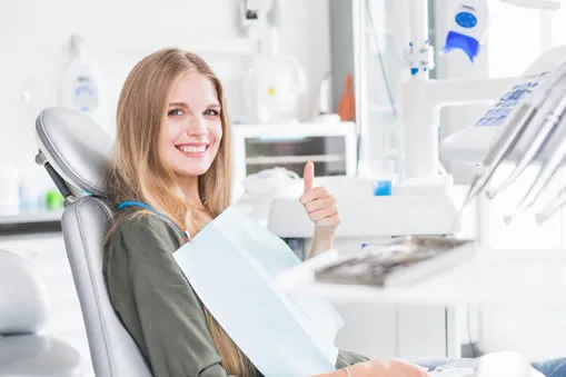 Young woman smiling during new patient dental exam